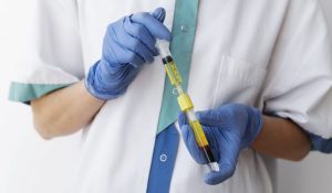front view doctor holding injection vial 1 scaled e1708156132878